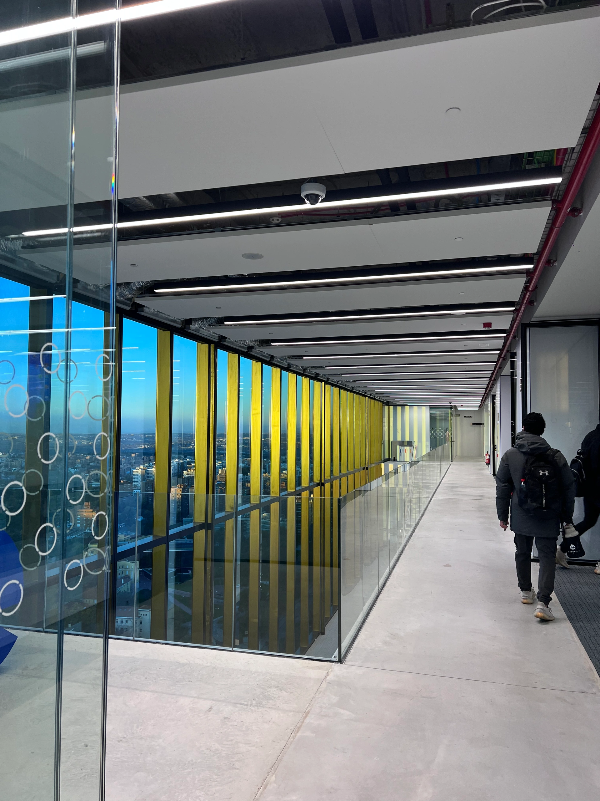 IE Tower corridor overlooking Madrid at dusk